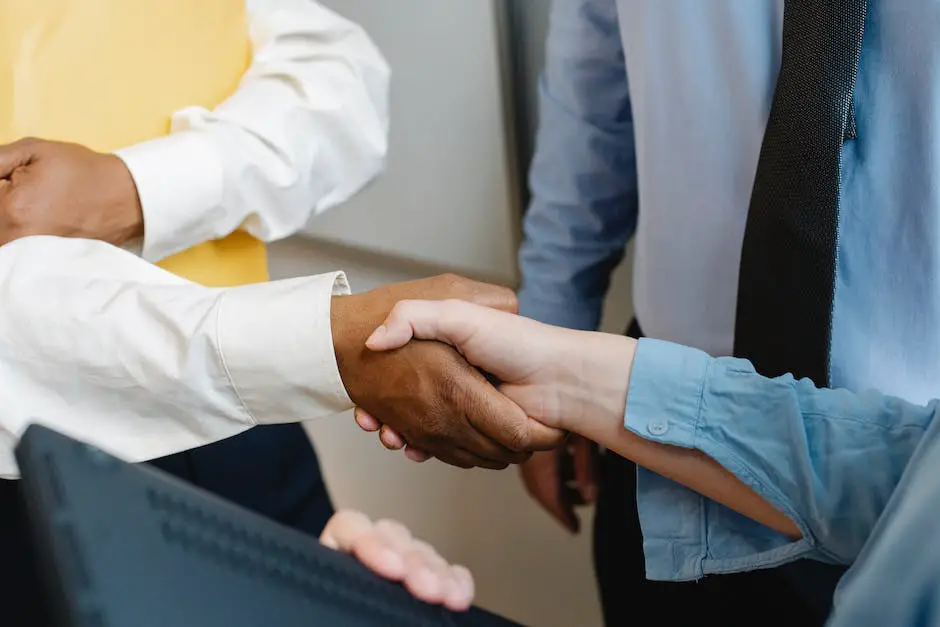 An image of two businesspeople shaking hands, representing good relationships and effective leadership.
