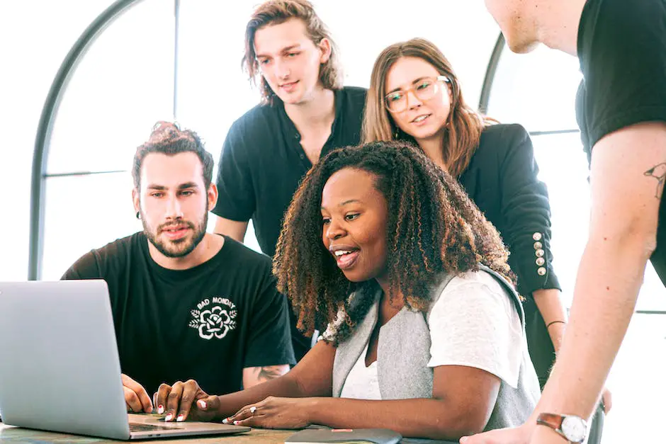 Image of a diverse group of people collaborating and discussing together in a workplace setting.